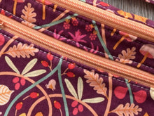 Load image into Gallery viewer, Fanny Pack Medium Size  Plum Color with leaves and vines in apricot, tangerine and green Fabric with Nickel Hardware close up of zipper color