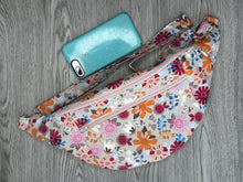 Load image into Gallery viewer, Fanny Pack Large Taupe Background with Orange, hot pink and various flowers   with Nickel Hardware  iphone 11 to show size 