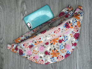 Fanny Pack Large Taupe Background with Orange, hot pink and various flowers   with Nickel Hardware  iphone 11 to show size 