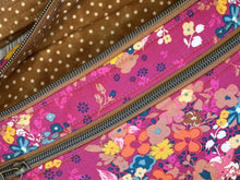 Load image into Gallery viewer, Close up of Fabric Hot Pink Fabric, multi colored flowers, Mocha Vinyl , polka dot liner and fabric strap  Large Fanny Pack 