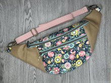 Load image into Gallery viewer,  Blue Floral fabric with Pinks, Yellows and Greens Taupe Vinyl  Large Fanny Pack with blush cotton Webbing  and Brass Hardware 