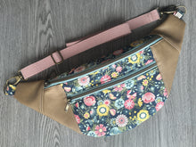 Load image into Gallery viewer,  Blue Floral fabric with Pinks, Yellows and Greens Taupe Vinyl  Large Fanny Pack with blush cotton Webbing  and Brass Hardware 